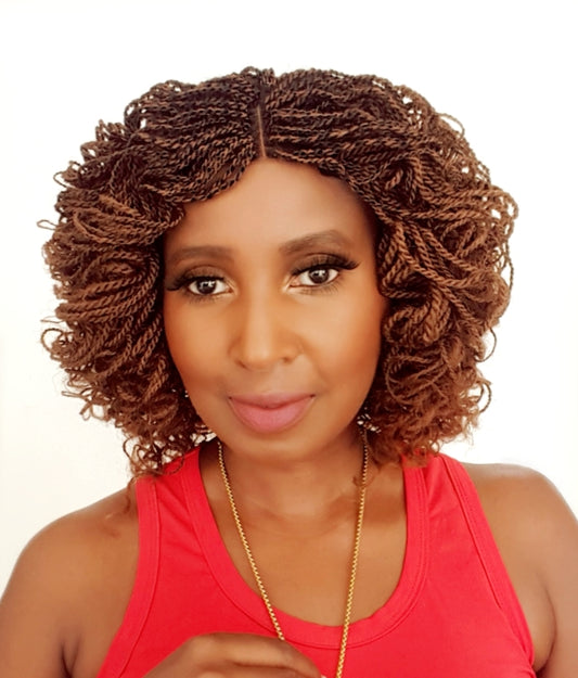 This is a light brown 2*4 Closure Twist Braided Wig, Short in Length Approximately 10". Made with Kinky Synthetic braids into a Kinky Twisted Curly Goodness. Handmade with Quality Synthetic Braids, Comes in; Black, Light Brown, Brown & Red Color . It is Light Weight Approximately 500g. Inside the Cap Structure is; 2*4 closure, 2 Small combs inside the cap, Adjustable Straps at the Back, Elastic on the side and it Ships in 3 - 5 days with FREE SHIPPING WORLDWIDE.