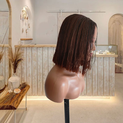 Mannequin head with brown hair in a modern interior setting