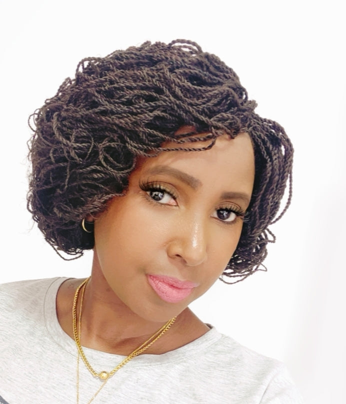 This is a brown 2*4 Closure Twist Braided Wig, Short in Length Approximately 10". Made with Kinky Synthetic braids into a Kinky Twisted Curly Goodness. Handmade with Quality Synthetic Braids, Comes in; Black, Light Brown, Brown & Red Color . It is Light Weight Approximately 500g. Inside the Cap Structure is; 2*4 closure, 2 Small combs inside the cap, Adjustable Straps at the Back, Elastic on the side and it Ships in 3 - 5 days with FREE SHIPPING WORLDWIDE.