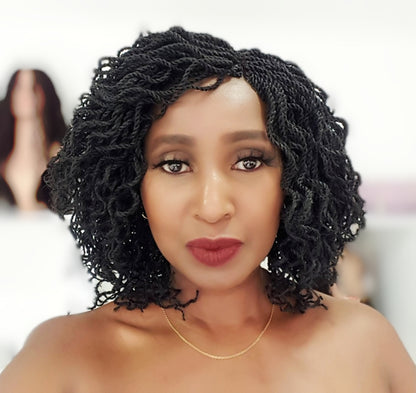This is a Black 2*4 Closure Twist Braided Wig, Short in Length Approximately 10". Made with Kinky Synthetic braids into a Kinky Twisted Curly Goodness. Handmade with Quality Synthetic Braids,  Comes in; Black, Light Brown, Brown & Red Color . It is Light Weight Approximately 500g. Inside the Cap Structure: 2*4 closure, 2 Small combs inside the cap, Adjustable Straps at the Back, Elastic on the side and it Ships in 3 - 5 days with FREE SHIPPING WORLDWIDE.